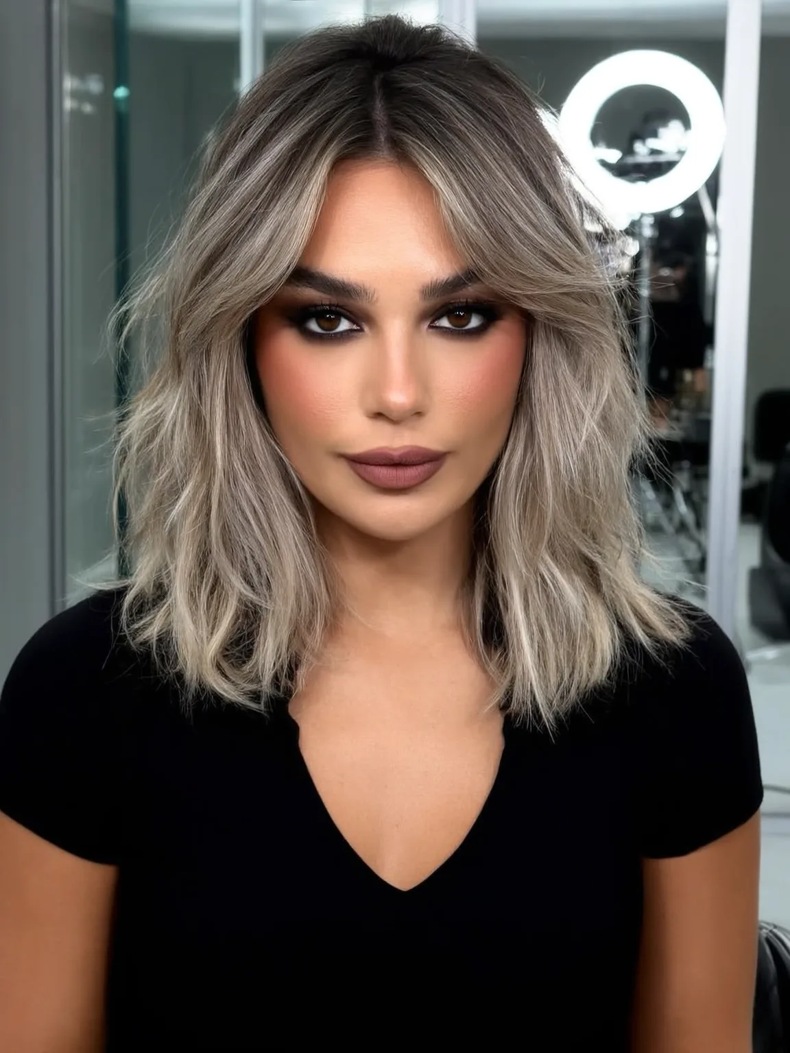 Wavy Ash Blonde Long Bob with Dark Roots and Curtain Bangs